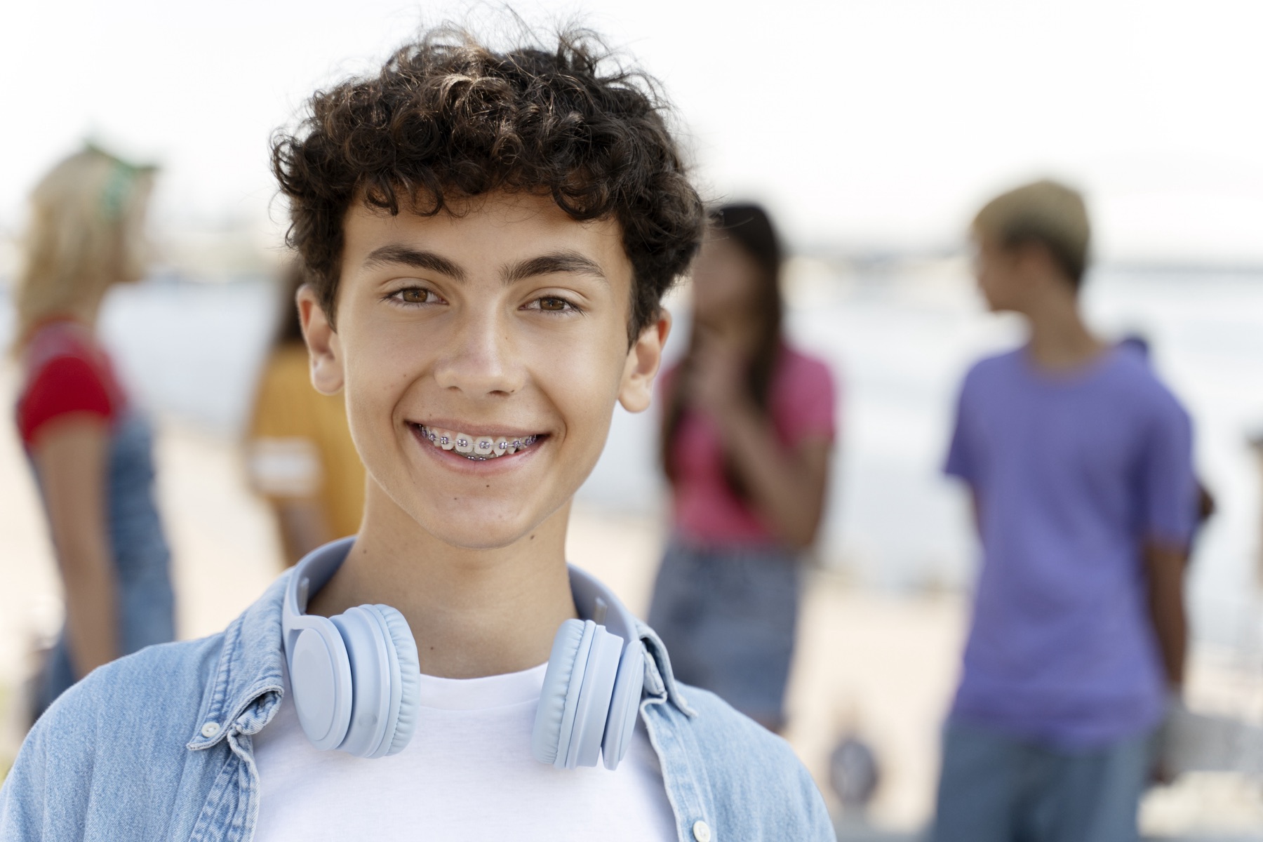 Teenage boy wearing traditional metal brackets